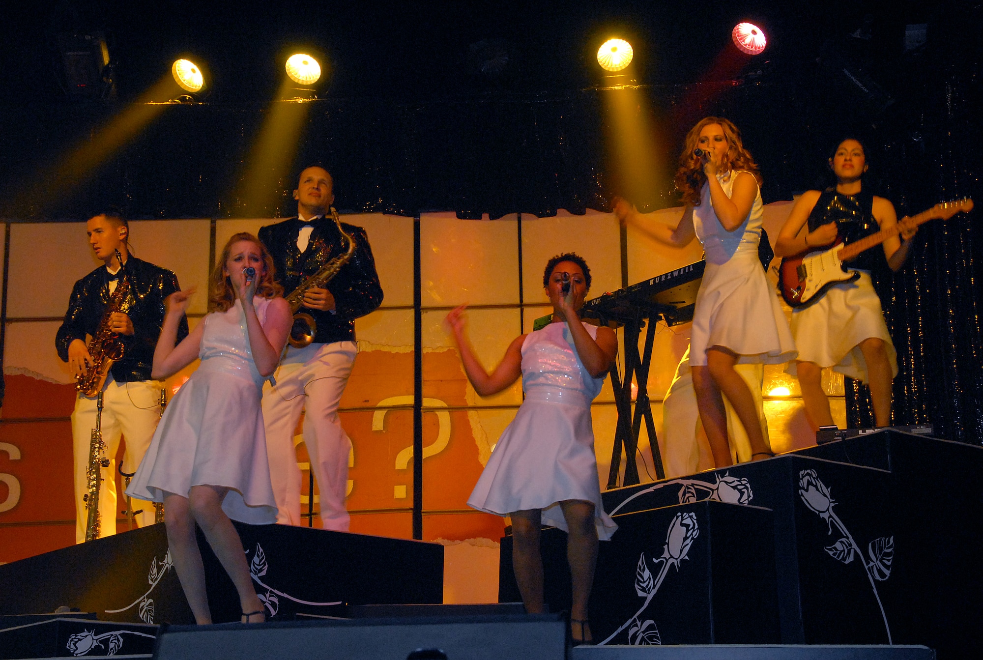 A trio of female Tops In Blue vocalists perform Jan. 29 at the Wichita Auditorium. The Air Force's premier entertainment group made its annual stop to perform for military and civilians. (U.S. Air Force photo/Mike Litteken)