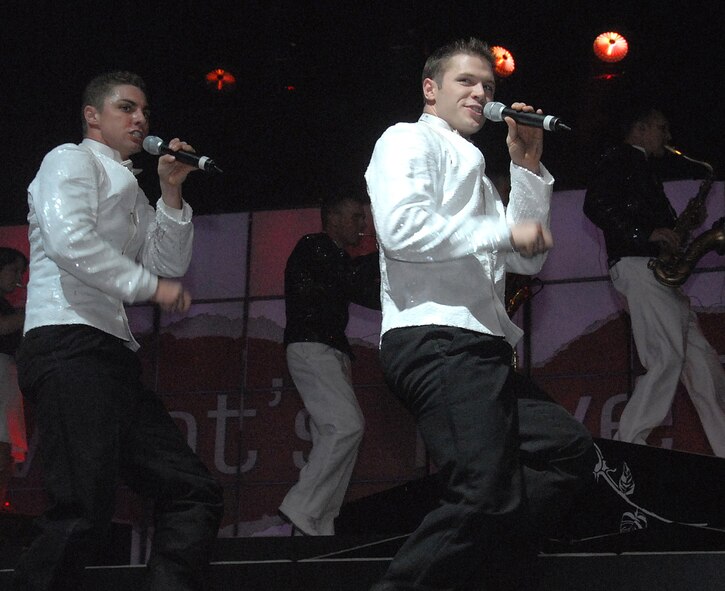 Senior Airman Shiloh Pogue, left, and Senior Airman Daniel Griner work their way across the stage at the Wichita Auditorium Jan. 29 during the Air Force's Tops In Blue production. (U.S. Air Force photo/Mike Litteken)