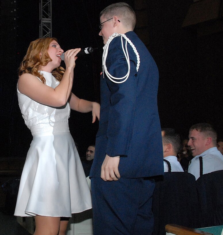 A favorite activity for Tops in Blue members is to grab people from the audience for a late evening serenade. First Lt. Carolynn Czegiga, from Tyndall Air Force Base, Fla., found an Airmen-in-Training to sing to during the group's performance Jan. 29 at the Wichita Auditorium. (U.S. Air Force photo/Mike Litteken)