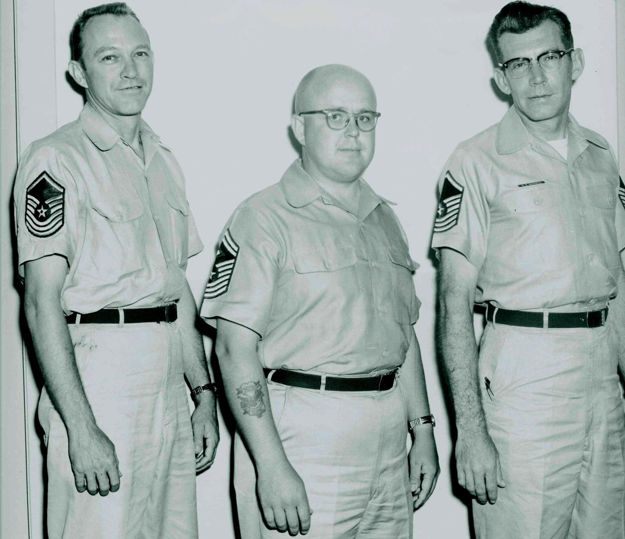 Chief Master Sgt. Al Kremer (center) enjoys his new chief's stripes June 1, 1960, at Sidi Slimane Air Base, Morocco, where he served as the first sergeant for the 1975 Airways and Air Communications Squadron there. Today, retired Chief Kremer is an Air Force civilian employee at United States Strategic Command headquarters at Offutt Air Force Base, Neb.  He recently eclipsed a combined 60 years of service as a military member and civilian employee. (Courtesy photo) 