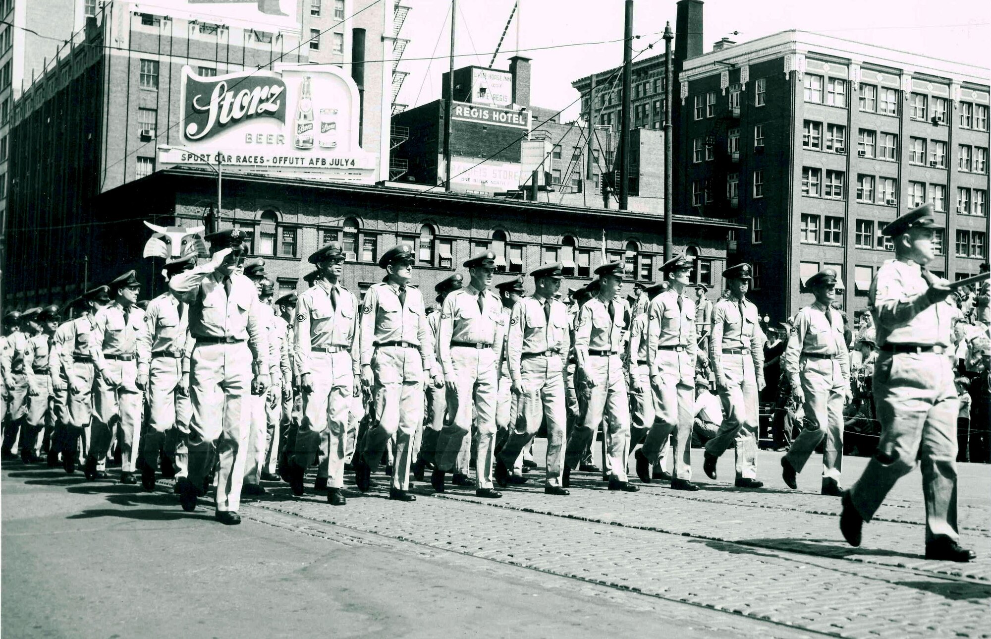 Then Tech. Sgt. Al Kremer (far right), today a retired chief master sgt. and Air Force civilian employee at United States Strategic Command headquarters at Offutt Air Force Base, Neb., leads a flight of Offutt Airmen in a parade in downtown Omaha in 1953.  He recently eclipsed a combined 60 years of service as a military member and civilian employee.  (Courtesy photo)