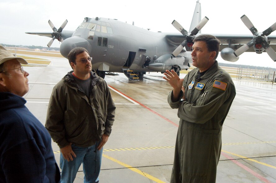 Brig. Gen. Bradley A. Heithold (right) speaks with Dan Richardson and Kevin Kelly in front of the AC-130U Gunship after a release ceremony Jan. 22 at Robins Air Force Base, Ga. Maintainers repaired the gunship in only 146 days and four days ahead of schedule. (U. S. Air Force photo/Sue Sapp)
