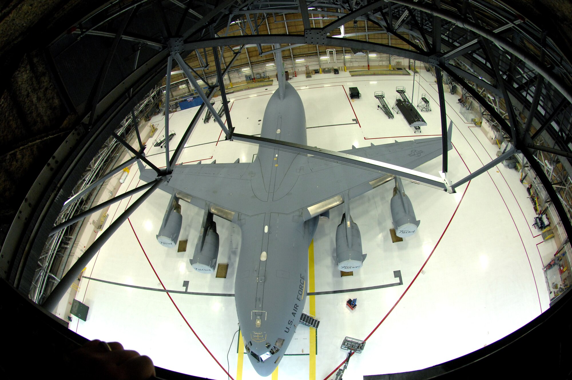 A C-17 Globemaster III sits in Hangar 3 after being pressure washed during a routine home station inspection Jan. 29 at McChord Air Force Base, Wash. Regular aircraft cleaning enhances the aircraft's aerodynamic efficiency and overall appearance. (U.S. Air Force photo/Abner Guzman)
