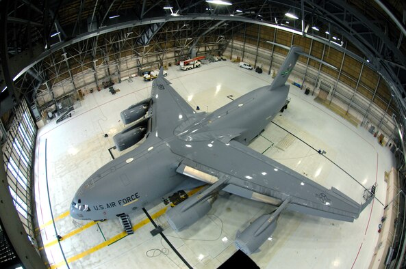 A C-17 Globemaster III sits in Hangar 4 after being pressure washed during a routine home station inspection Jan. 29 at McChord Air Force Base, Wash. Regular washing and rinsing prevent and control aircraft corrosion. (U.S. Air Force photo/Abner Guzman)
