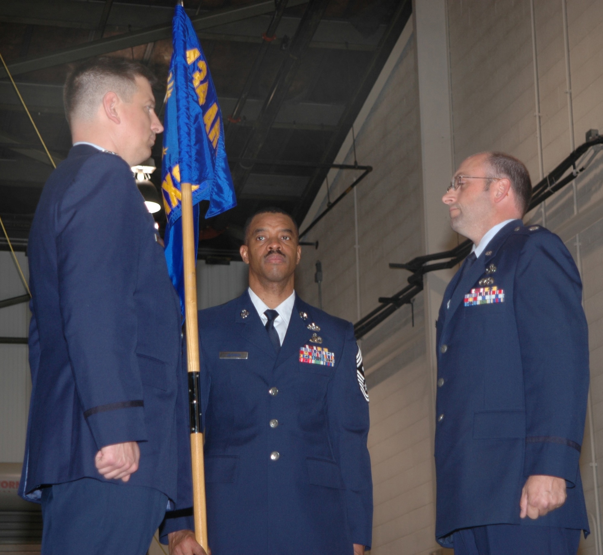 GRISSOM AIR RESERVE BASE, Ind.,--Lt.Col. Arthur VanHouten, right,  assumes command of the 434th Maintenance Squadron from Colonel Stan Sheley in ceremonies conducted in January.  Assisting in the ceremony is Chief Master Sgt. Chris Jackman. (U.S. Air Force photo/Senior Airman Chris Bolen)