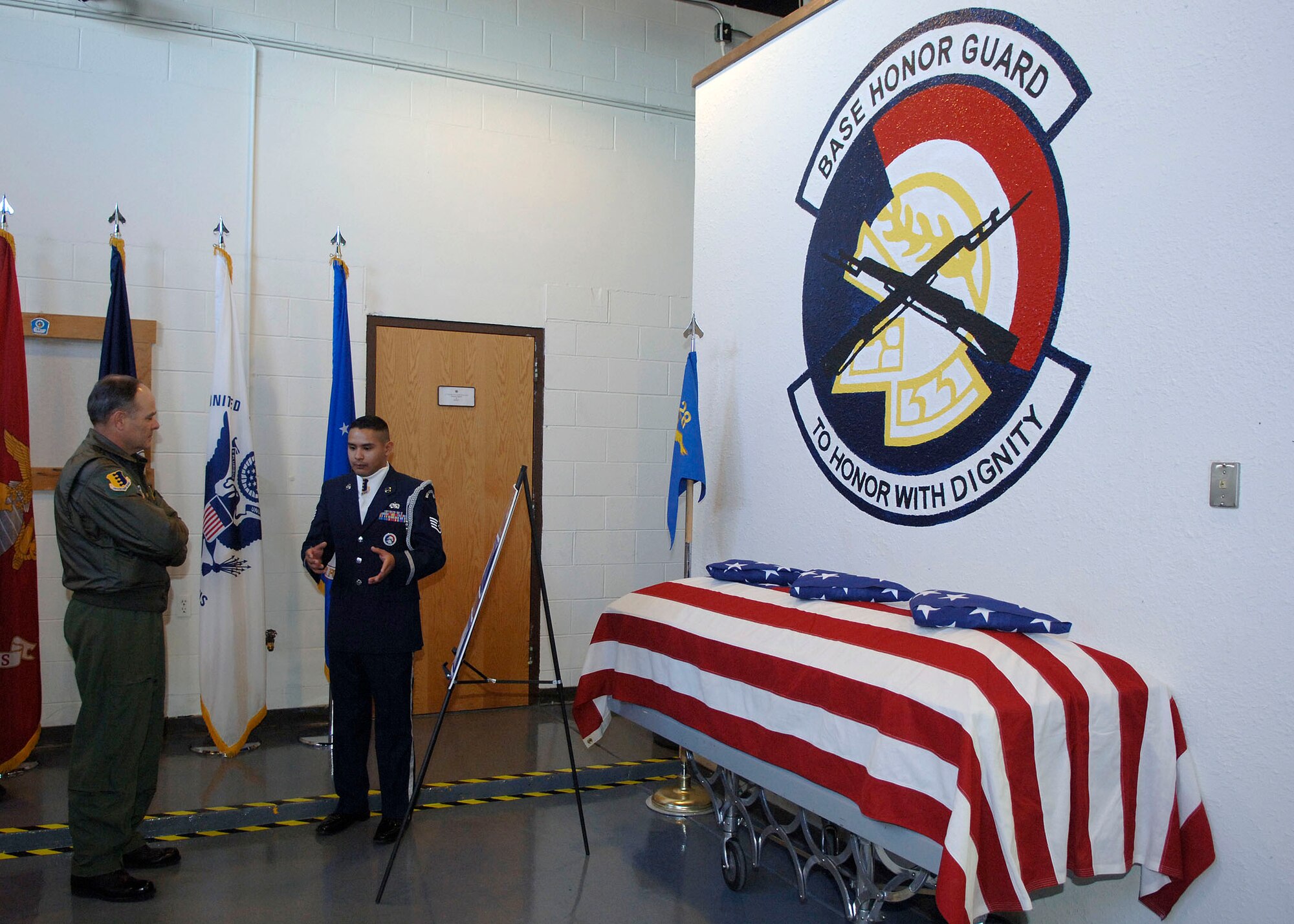 Brig. Gen. Joseph Mudd, 12th Air Force and Air Forces Southern vice commander, receives a briefing from Staff Sgt. Ruben TrejoSanchez, NCO in charge of Ellsworth's honor guard. After the briefing, the silent exhibition drill team demonstrated their capabilities in a performance showcasing their precision movements with fully operational M-1 Garand rifles. (Air Force photo by Staff Sgt. Michael Keller)
