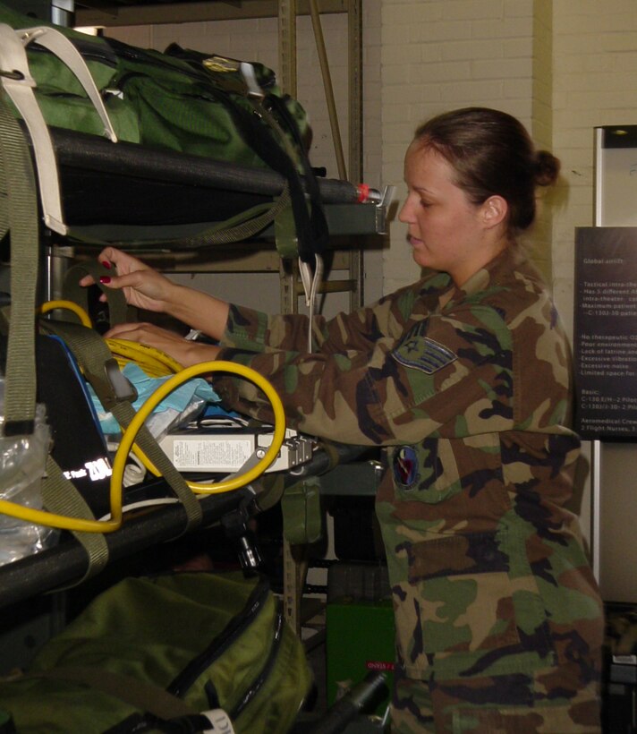 SCOTT AFB, Ill -- Staff Sgt. Brandy Miller from the 775th Expeditionary Aeromedical Evacuation Squadron checks aeromedical equipment used by medical crewmembers when transporting patients. Sergeant Miller is deployed to Scott AFB from the 445th Aeromedical Evacuation Squadron at Wright-Patterson AFB, Ohio (U.S. Air Force photo).  