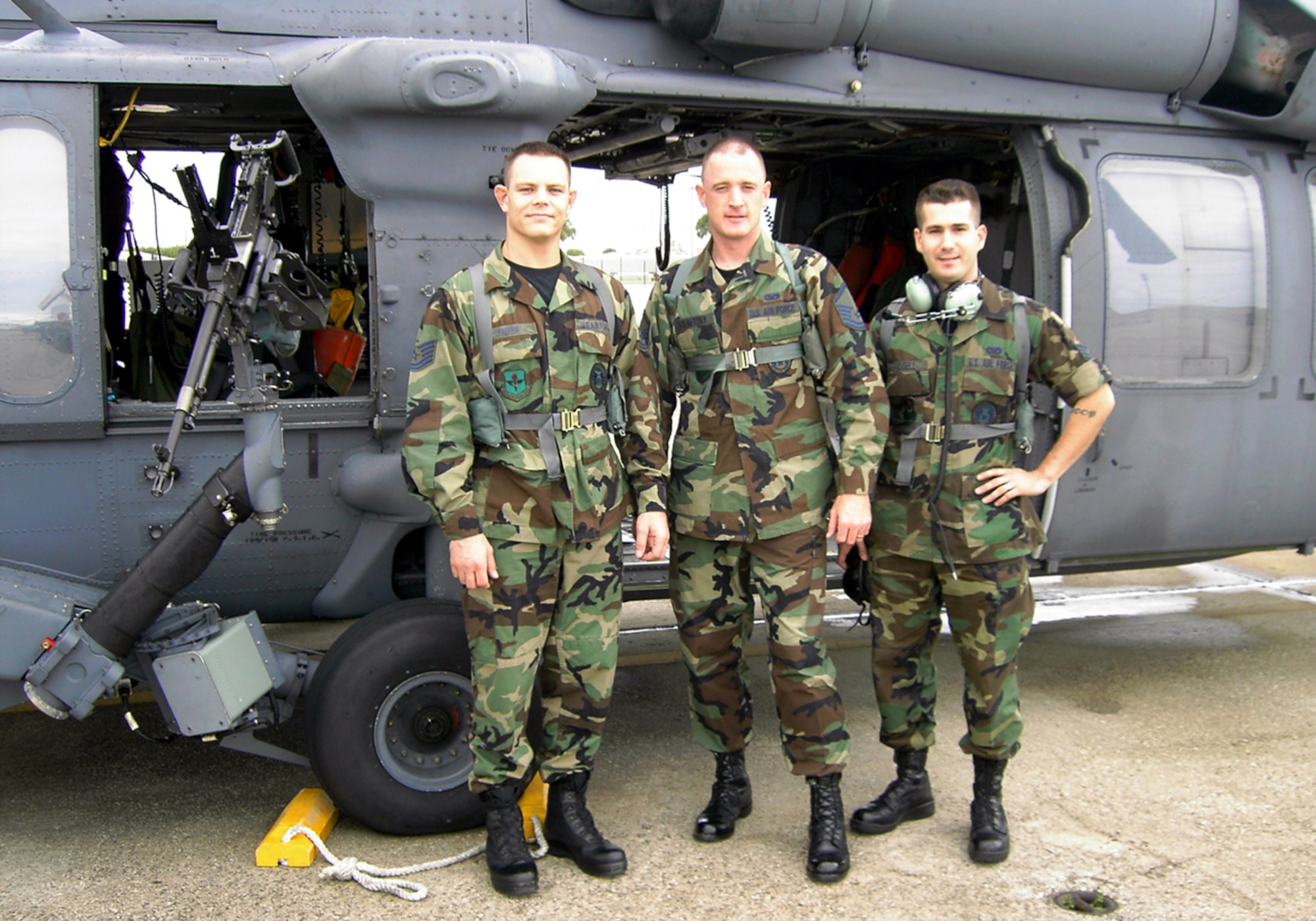 From left, Tech. Sgt. Vincent Phifer, Master Sgt. Dave Kolmetzky and Staff Sgt. Benjamin Russell, members of the 333rd Recruiting Squadron, prepare for their incentive ride an HH-60G Jolly Green helicopters Dec. 13 at Patrick Air Force Base. (U.S. Air Force photo)