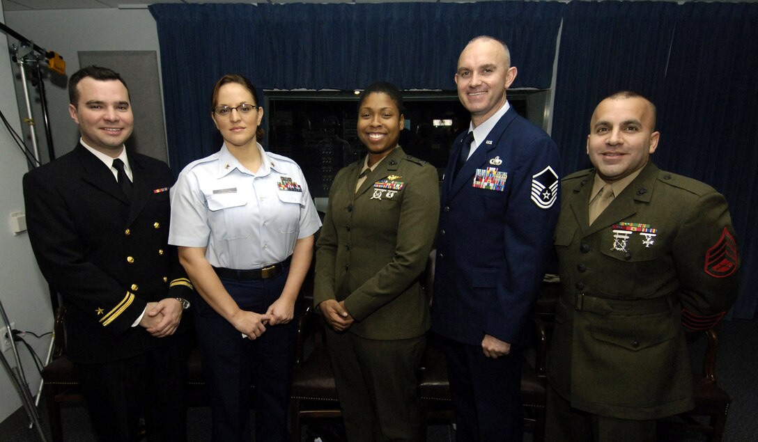 Among 11 servicemembers featured in a new DoD documentary, "Today's Military: Extraordinary People; Extraordinary Opportunities," are (from left) Navy Reserve Lt. j.g. Fernando Rivero, Coast Guard Reserve Petty Officer 2nd Class Trish Carroll, Marine Capt. Vernice Armour, Air Force Master Sgt. John Holsonback and Marine Staff Sgt. Stephen Giove. Photo by Petty Officer 1st Class Chad McNeeley, USN