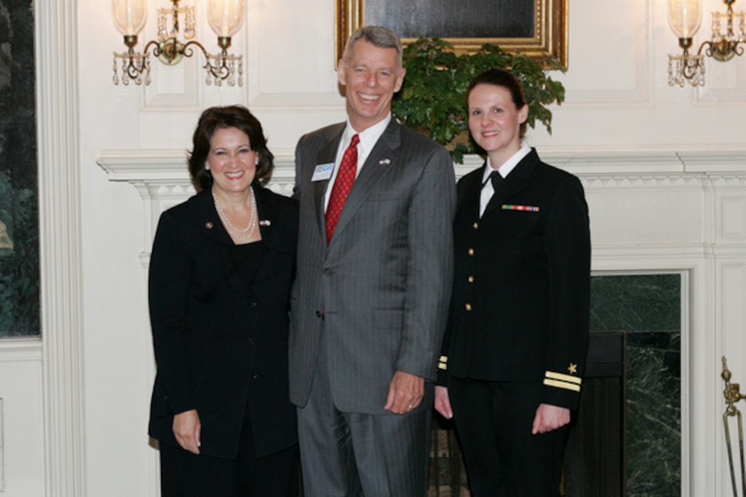 Anita McBride (left), chief of staff to first lady Laura Bush poses with Bob Hollingsworth, executive director, National Committee for Employer Support of the Guard and Reserve, and Maria Miller, deputy director of policy in the Office of the First Lady and a Naval Reserve lieutenant, after receiving the Patriot Award April 19 for her employment and outstanding support of military reservists during a ceremony at the White House.  McBride was nominated by Miller to receive the award, which recognizes employers for employment policies and practices supportive of their employees' participation in the National Guard and Reserve. Photo by Shealah Craighead