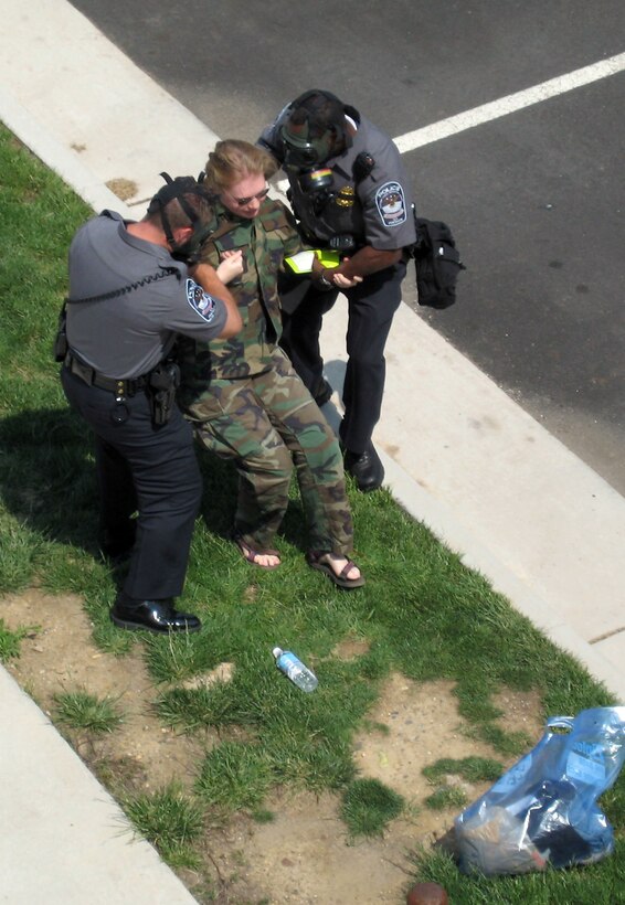 Pentagon Force Protection Agency members assist a Red Cross volunteer simulating symptoms of anthrax infection during Gallant Fox 06 May 17 in the Pentagon parking lot. The exercise tested the response of Pentagon police and local and federal agencies to a biological attack at the Pentagon. Photo by Sgt. Sara Wood, USA