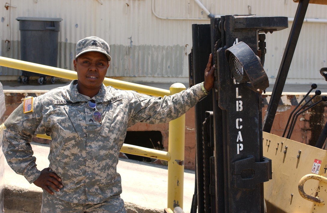 Army Sgt. Michelle Harrison, deployed to U.S. Naval Station Guantanamo Bay, said she takes consolation missing Mother's Day with her kids by knowing that protecting their freedom is the best gift she could give them. Photo by Spc. Matthew Willingham, USA