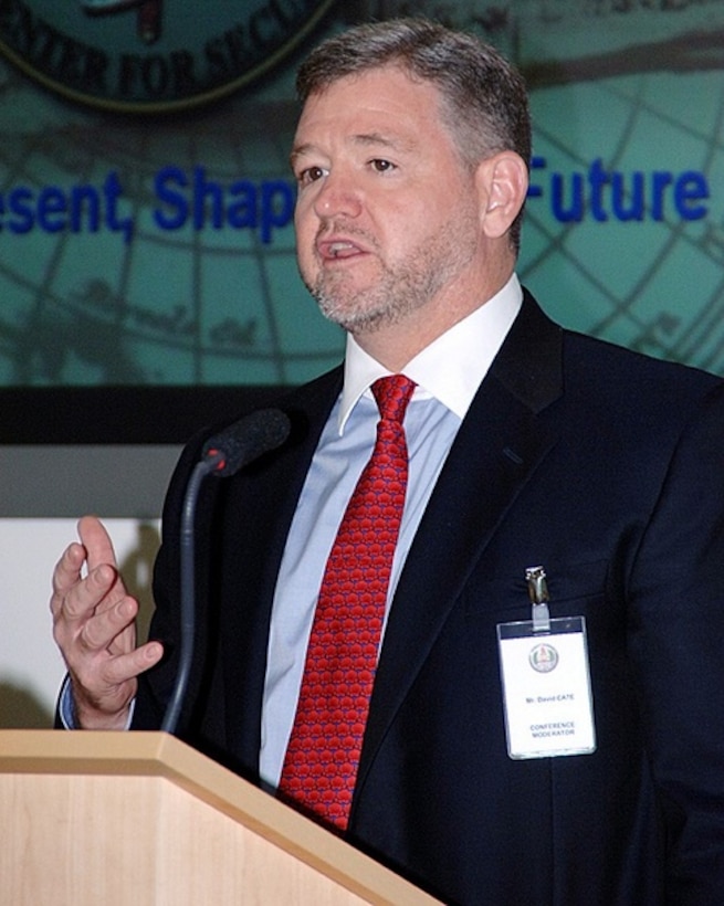 David A. Cate, the Defense Department's deputy director of the plans and programs office of the deputy assistant secretary of Eurasia policy, opens a multinational conference June 27 at the George C. Marshall European Center for Security Studies in Garmisch-Partenkirchen, Germany. The conferees are discussing manpower, personnel, training and education. Photo courtesy of the George C. Marshall European Center for Security Studies
