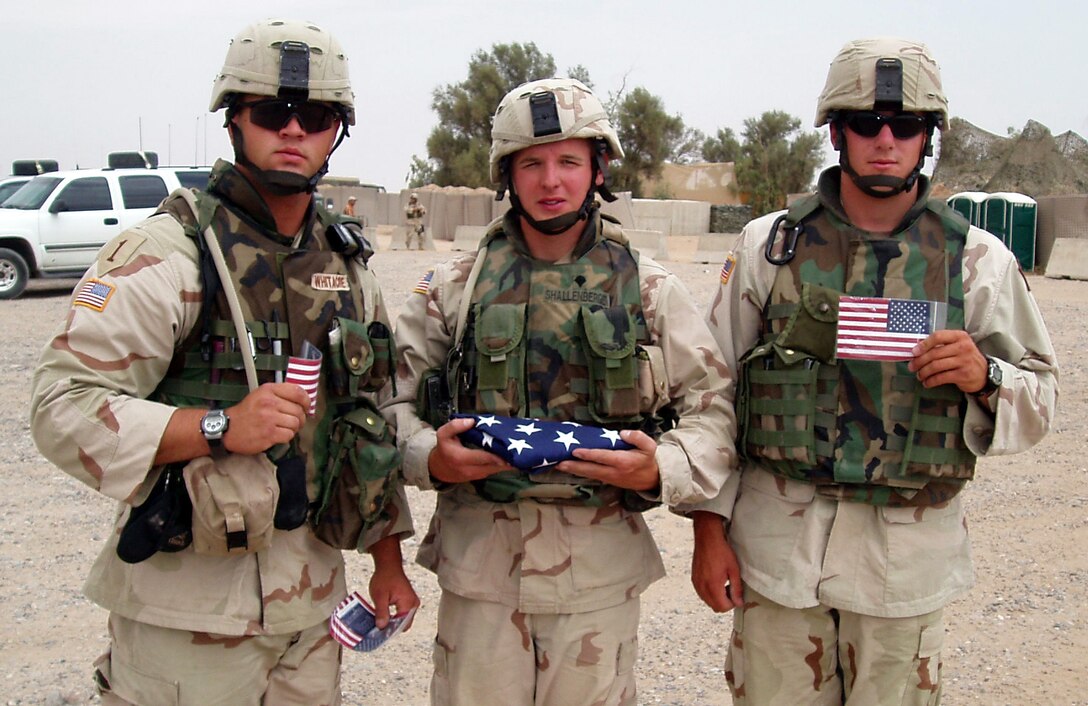 4th Infantry Division soldiers near Bayji, Iraq, hold pocket flags they received inside "Project Prayer Flag" kits. Courtesy photo