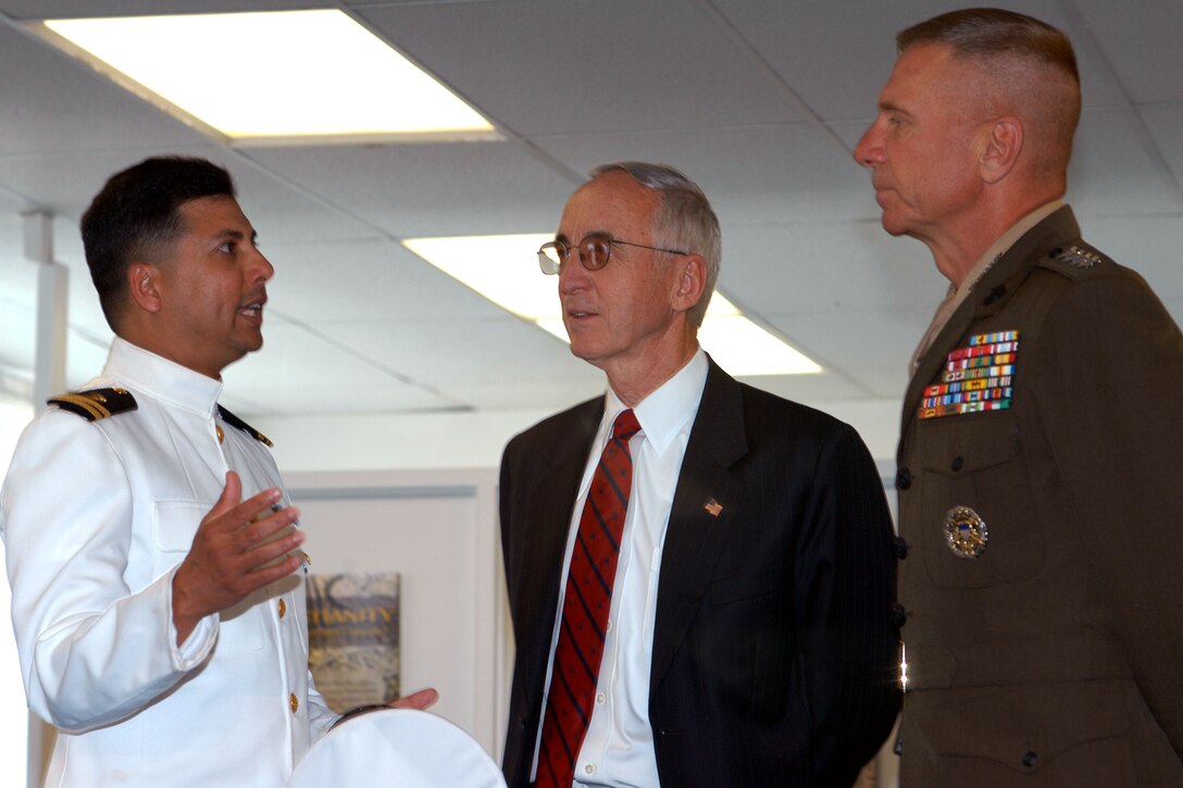 Navy Lt. Saiful Islam, Headquarters and Service Battalion chaplain (left), talks with Deputy Defense Secretary Gordon England (center) and Marine Corps Commandant Gen. Michael Hagee, talk inside Marine Corps Base Quantico's Islamic prayer center June 6. England and Hagee were on hand for the dedication of the center, the Marine Corps' first. Photo by Samantha L. Quigley