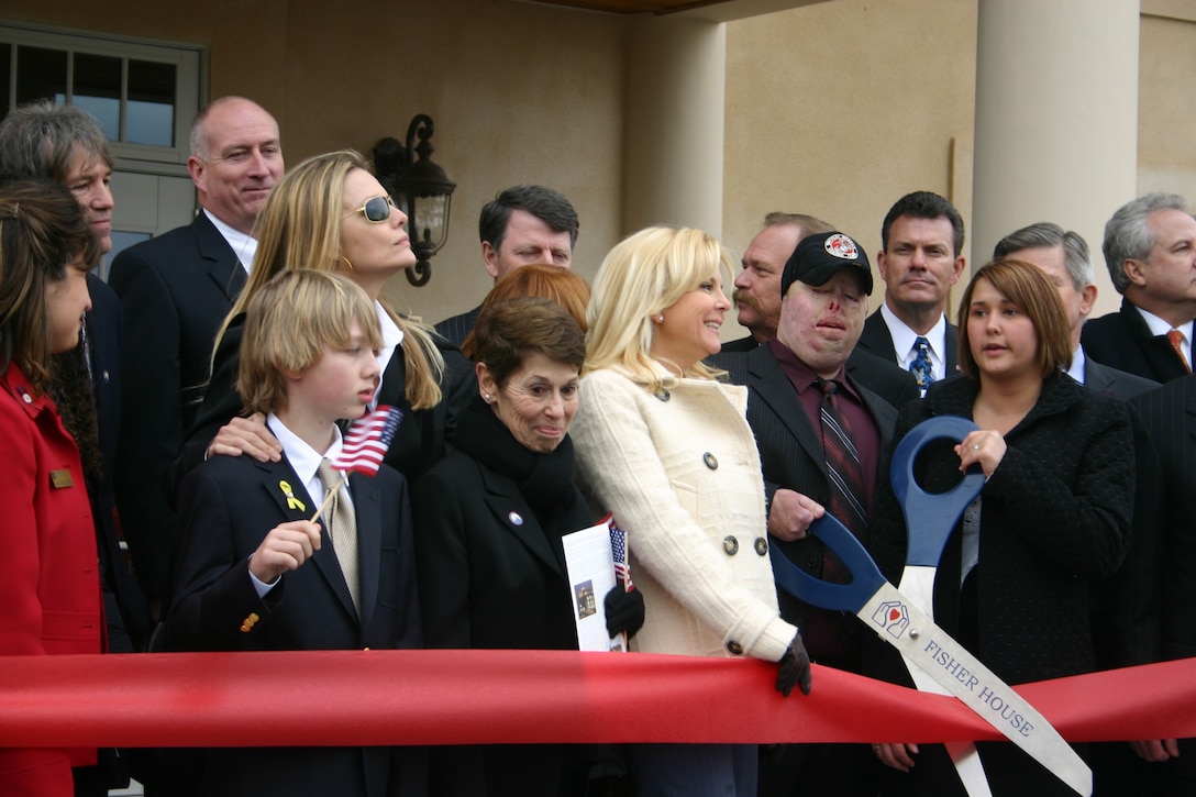 Wounded warrior Marine Cpl. Ty Ziegel cuts the ceremonial ribbon to