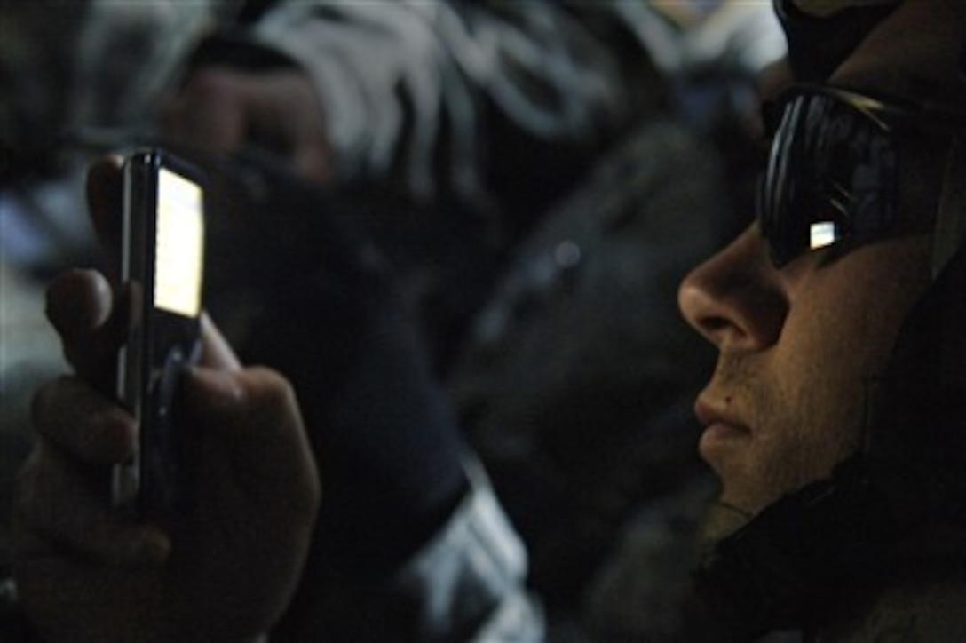 Army Sgt. Tyler Wheaton prepares to broadcast a message from a digital recorder telling Baghdad residents about cordon and search operations in Baghdad, Iraq, on Jan. 24, 2007.  Wheaton is attached to the Armyís Alpha Company, 5th Battalion, 20th Infantry Regiment, 3rd Brigade Combat Team, 2nd Infantry Division.  