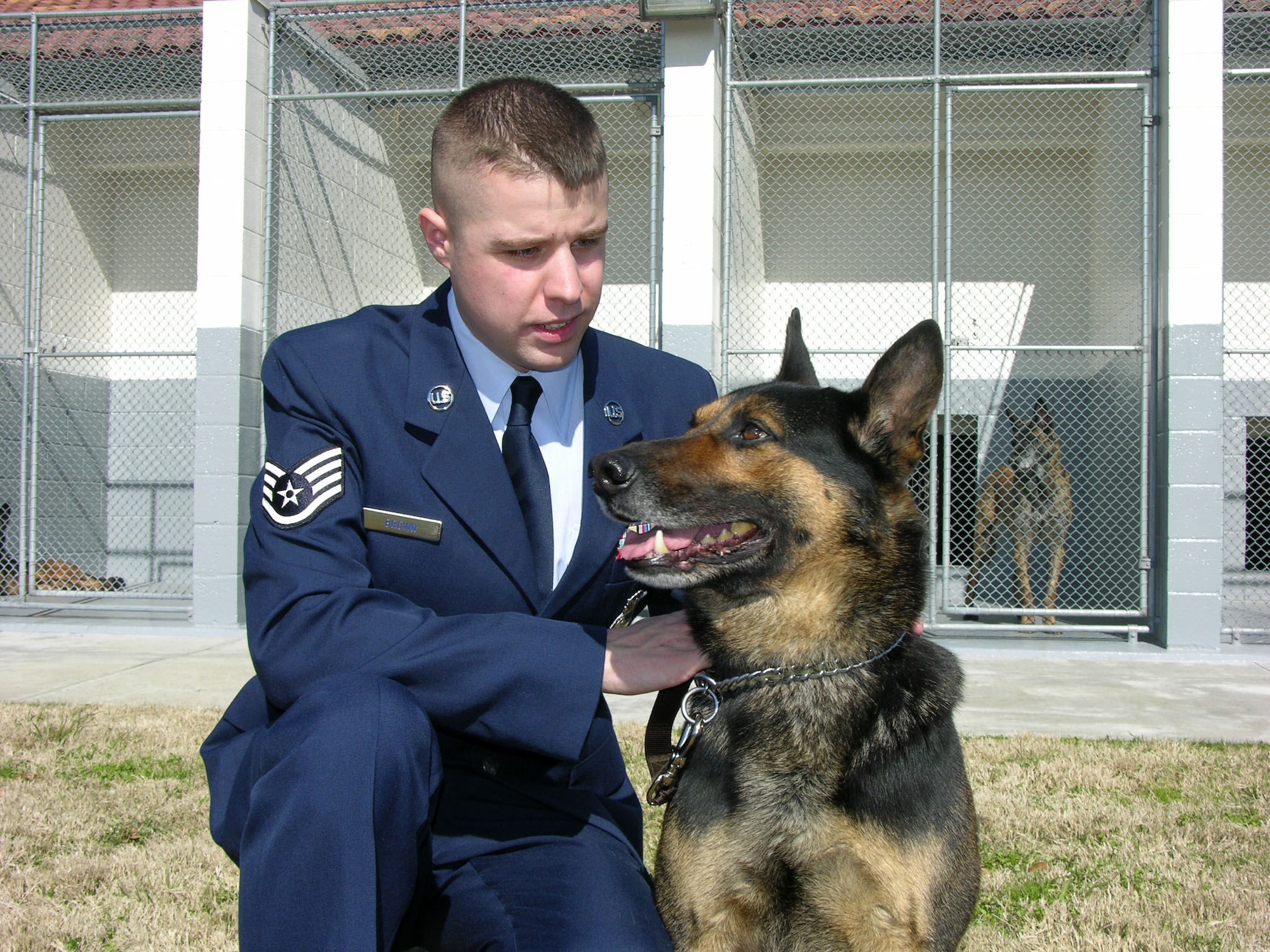 Staff Sgt. Robert Brown, 42nd Security Forces Squadron working dog handler at Maxwell Air Force Base, Ala., received a Purple Heart Jan. 31 for wounds he sustained when he and his military working dog Nero deployed to Iraq. While checking a field near Tahrir City, Iraq, Nero warned the sergeant to an improvised explosive device hidden in the field. The IED was then detonated by an insurgent, and Sergeant Brown suffered a concussion and a contusion to his right leg.  (U.S. Air Force photo/Carl Bergquist)
