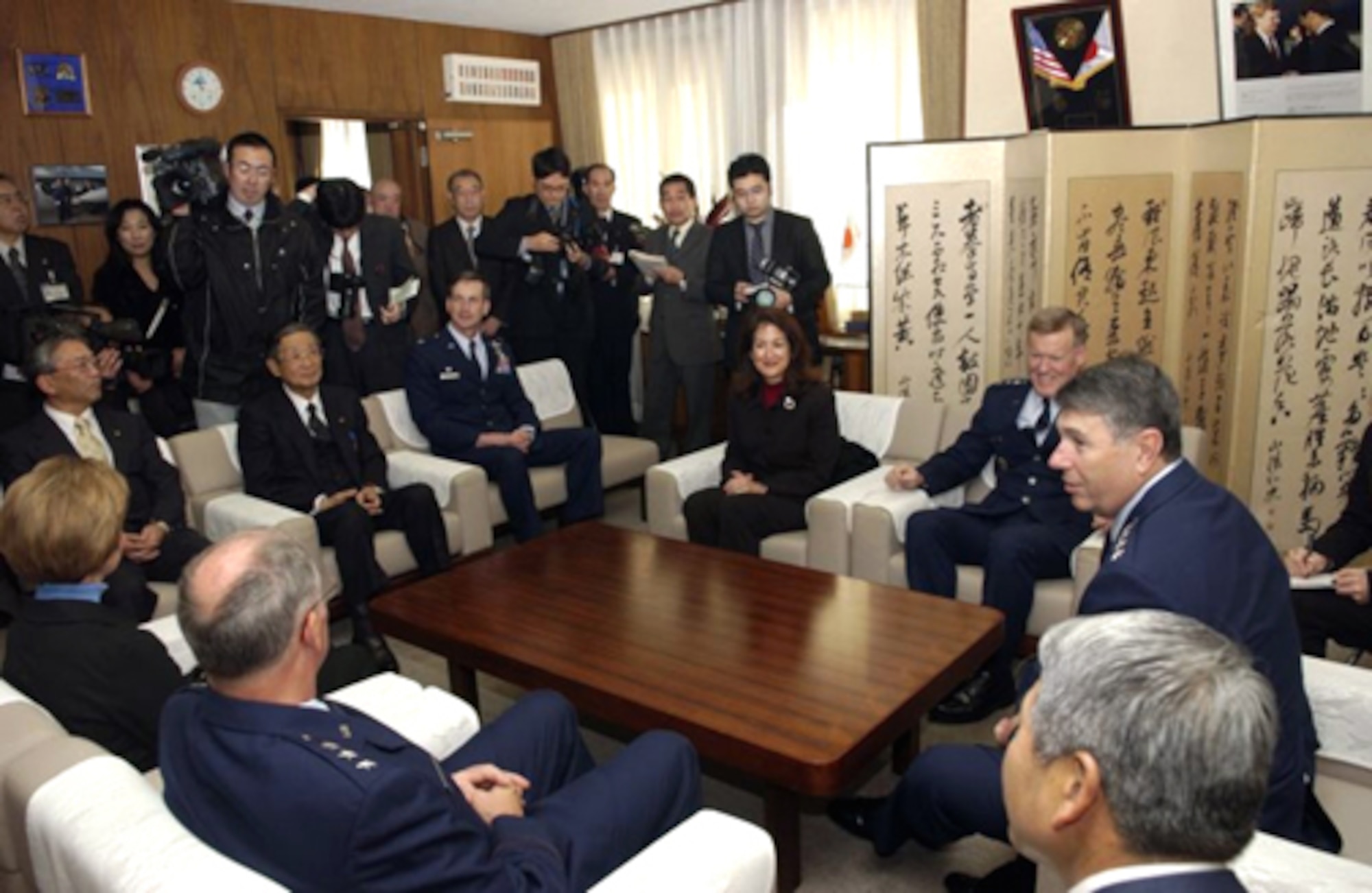 01/31/2007-- MISAWA CITY, Japan -- From left: Lt. Gen. Chip Utterback, 13th Air Force commander and his wife Sandy, Misawa City Vice Mayor Yoshida,  Misawa City Mayor Shigeyoshi Suzuki, Col. Terrence O'Shaughnessy, 35th Fighter Wing commander, Mrs. Kerri Wright, Lt. Gen. Bruce Wright, 5th Air Force and United States Forces Japan commander, and Gen. Paul Hester, Pacific Air Forces commander, gather at the mayor's office to share memories of their time serving as wing commanders at Misawa Air Base. (U.S. Air Force photo by Senior Airman Robert Barnett)