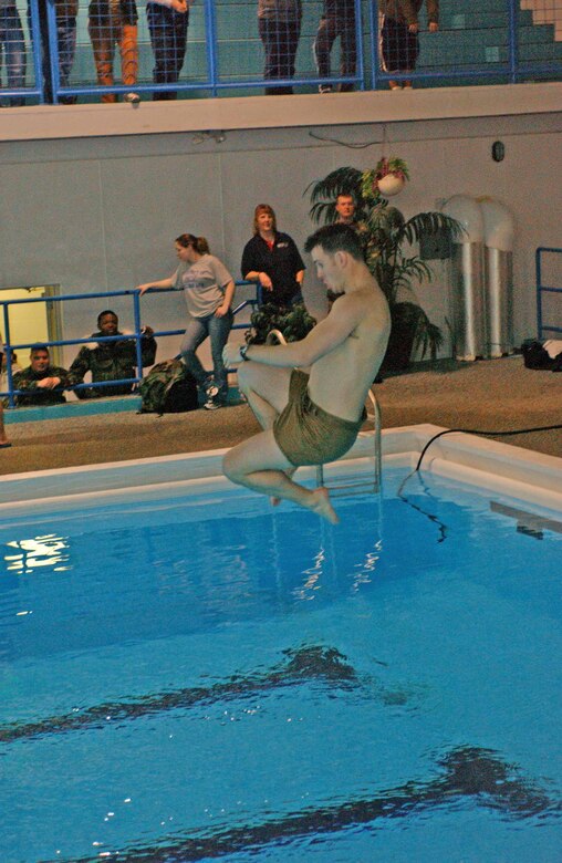 EIELSON AIR FORCE BASE, Alaska--Airmen compete in a stationary bike race during a four-person team competition at Jan. 26 at the fitness center. More that 400 Airmen and their families attended the X-Treme Winter Challenge hosted by the 354th Services Squadron and BASE 24/7. (U.S. Air Force photo by Senior Airman Rachel Walters)                               