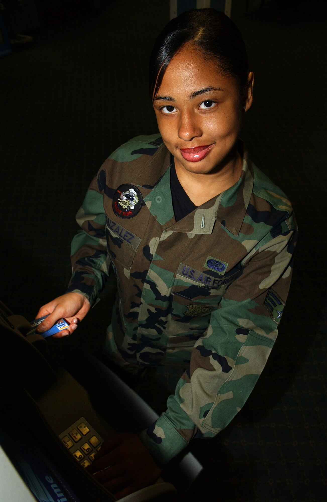 EIELSON AIR FORCE BASE, ALASKA-- Senior Airman (SrA) Johanna Gonzales uses an ATM located in the Gold Rush Inn. The ATM was moved from the BX hallway into the inn so that Airman and their families would have 24-Hour access to the ATM. Senior Airman Gonzales is assigned to the 354th Services Squadron, 354th Mission Support Group, 354th Fighter Wing.
(US Air Force photo by Senior Airman Anthony Nelson Jr)