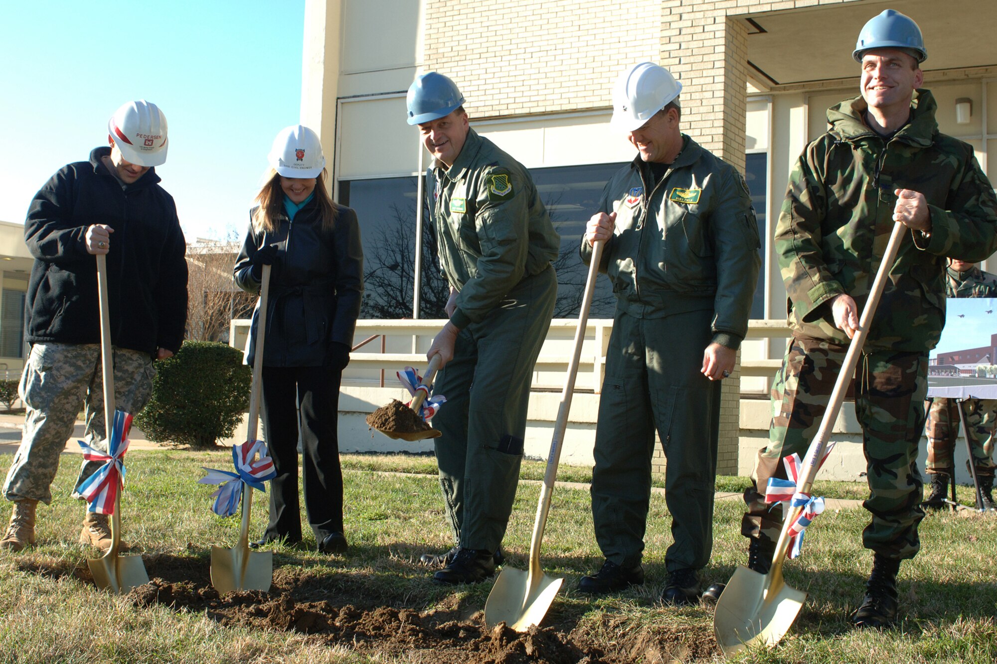 Brig. Gen. Burt Field, 1st Fighter Wing commander, Col. Kory Cornum, 1st Medical Group commander, and other distinguished visitors break ground on the 1st Fighter Wing hospital's $67 million addition Jan. 26. 