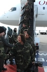 MINOT AIR FORCE BASE, N.D. -- Airmen are greeted by base leadership after returning from a deployment Jan. 30. More than 100 Airmen were met by friends and family upon arriving home from a five-month deployment to Andersen Air Force Base, Guam. (U.S. Air Force photo by Airman 1st Class Christopher Boitz)