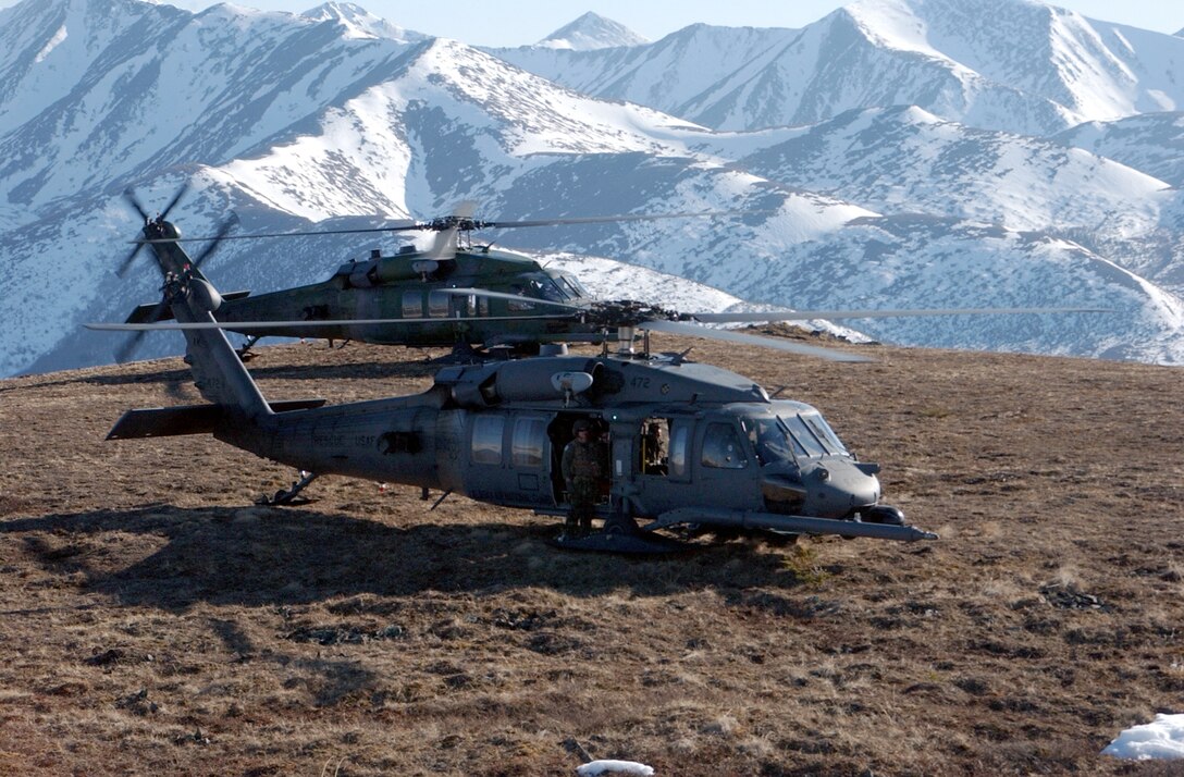 HH-60 helicopters, like these shown participating in an exercise at White Mountains, Alaska, are among the aircraft that will move when the Alaska Air National Guard's 176th Wing moves from Kulis Air National Guard Base to nearby Elmendorf Air Force Base in Anchorage, Alaska.  The move and closure of Kulis is part of a 2005 Base Realignment and Closure Commission recommendation.  No date has been set yet for the move.  (U.S. Air Force photo/Airman Justin Weaver)