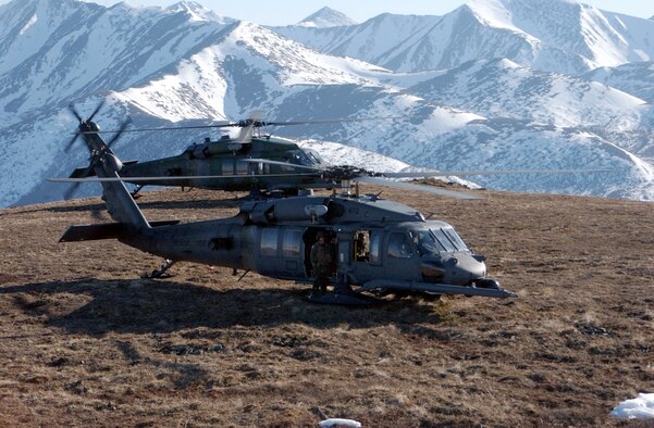 HH-60 helicopters, like these shown participating in an exercise at White Mountains, Alaska, are among the aircraft that will move when the Alaska Air National Guard's 176th Wing moves from Kulis Air National Guard Base to nearby Elmendorf Air Force Base in Anchorage, Alaska.  The move and closure of Kulis is part of a 2005 Base Realignment and Closure Commission recommendation.  No date has been set yet for the move.  (U.S. Air Force photo/Airman Justin Weaver)
