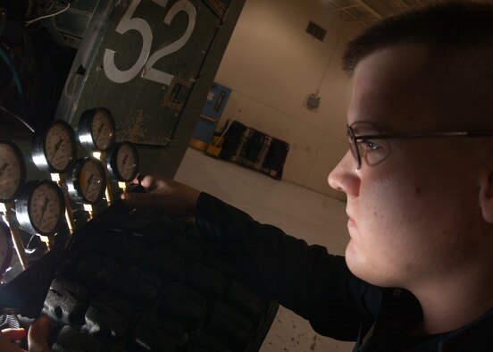 EIELSON AIR FORCE BASE, Alaska -- Senior Airman Jesse Hymer, 354th Logistic Readiness Squadron checks the pressure gauges on a Road Grader to see if the transmission and clutch are good at Vehicle Operations Building here on Jan. 30. This vehicle will have general inspection and maintenance done to it every six months. 
(US Air Force Photo by Airman Jonathan Snyder)