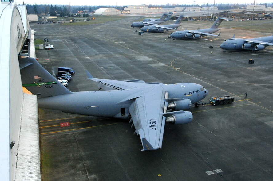 MCCHORD AIR FORCE BASE, Wash. -- A C-17 Globemaster III is towed into a hangar using an MB-2 aircraft tow tractor Jan. 26 for a home station inspection. (U.S. Air Force photo/Abner Guzman) 
