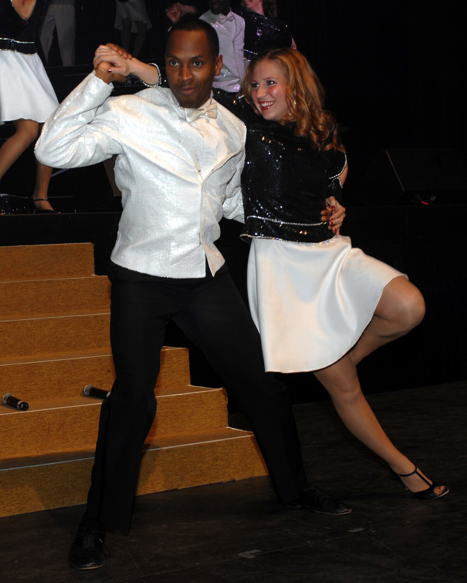 Technical Sergeant Kenneth Bruce Jr., NCOIC DGS-5 Stan/Eval from Hickman AFB, Hawaii, and 1st Lt. Carolynn Czepiga, protocol officer from Tyndall AFB, Fla.,  perform for the City of Abilene and Dyess AFB during the Tops in Blue concert January 23. The concert is performed all over the world including deployed locations. (U.S. Air Force photo by Senior Airman Courtney Garrard)