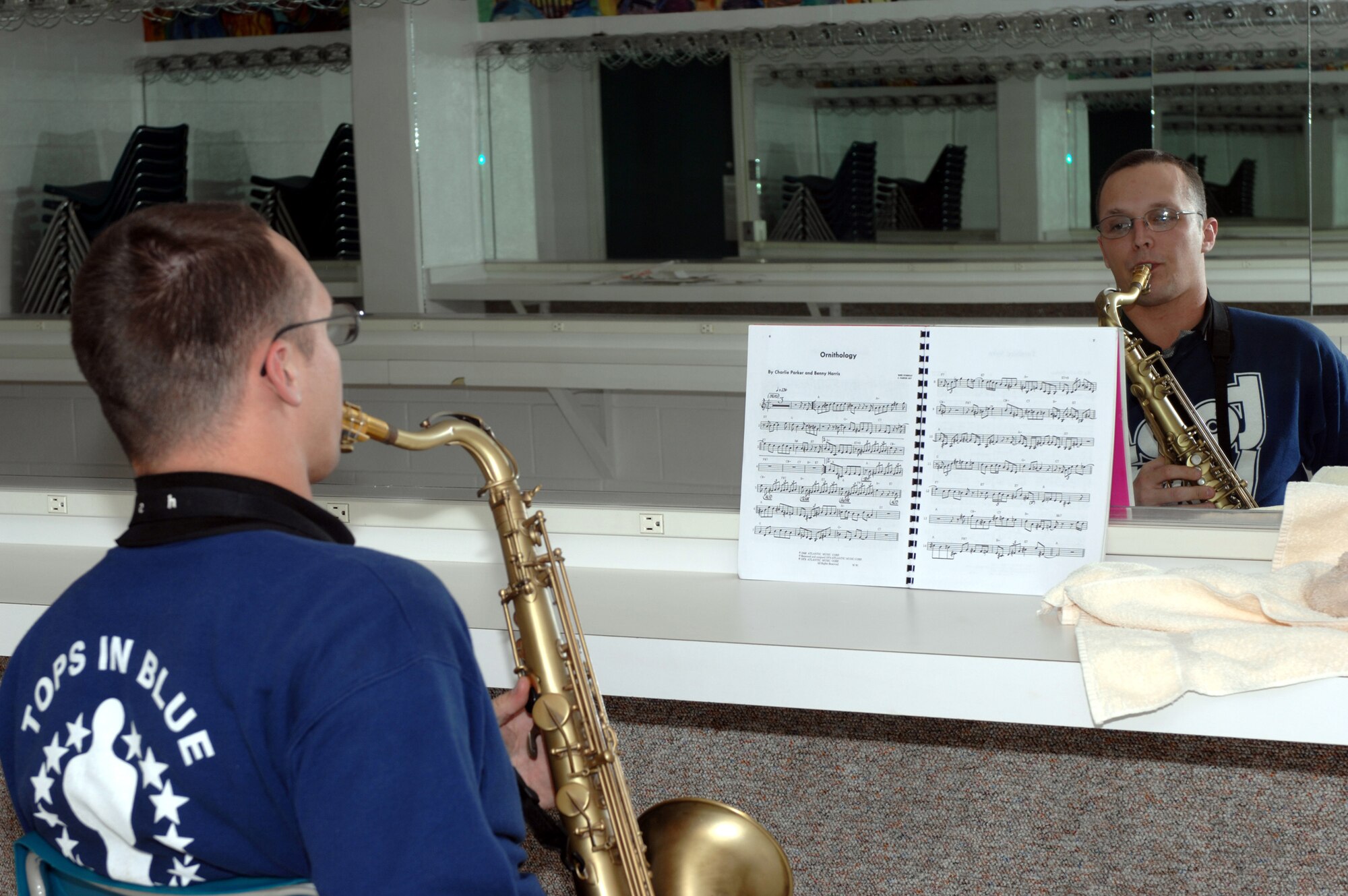 Senior Airman Nolan Wright, C-5 crew chief from Travis AFB, Cailf., rehearses the music before the Tops in Blue concert January 23. While on tour, the cast is still required to maintain their training, physical fitness and testing for promotions. (U.S. Air Force photo by Senior Airman Courtney Garrard)