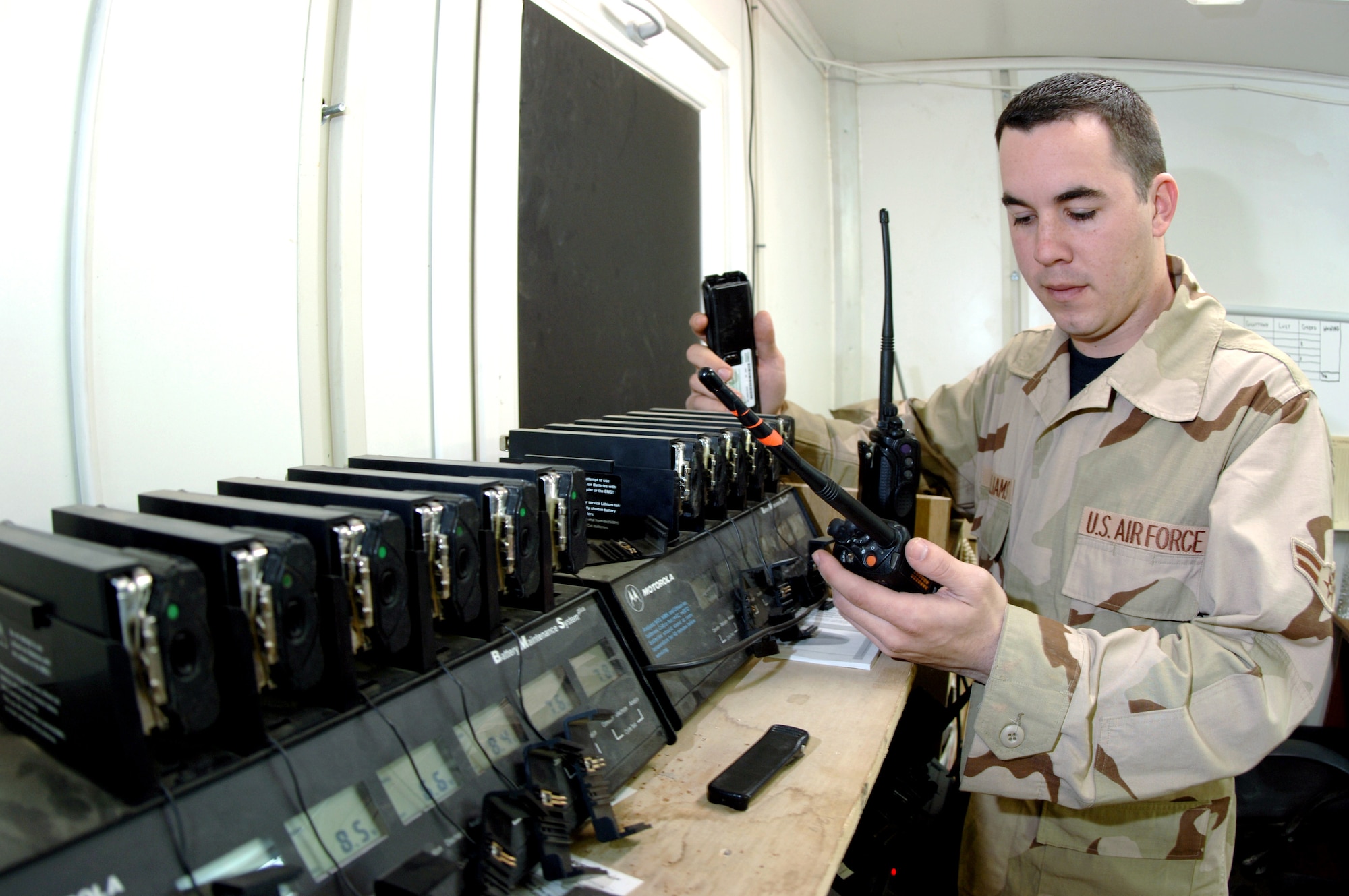 Airman 1st Class Matthew Williams does an operations check on land mobile radios to verify Airmen are getting proper communications out in the field Jan. 30 at Kirkuk Regional Air Base, Iraq. Airman Williams is a radio maintenance technician for the 506th Expeditionary Communications Squadron. (U.S. Air Force photo/Senior Airman Bradley A. Lail) 