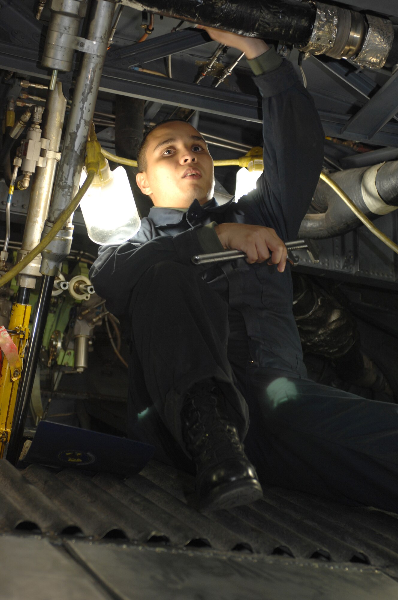 Airman First Class Santino Lopez works on the electrical system inside of a C-130. After every flight, these Airmen must check every system located inside and outside of the aircraft. (U.S. Air Force photo by Airman Jennifer Romig)   