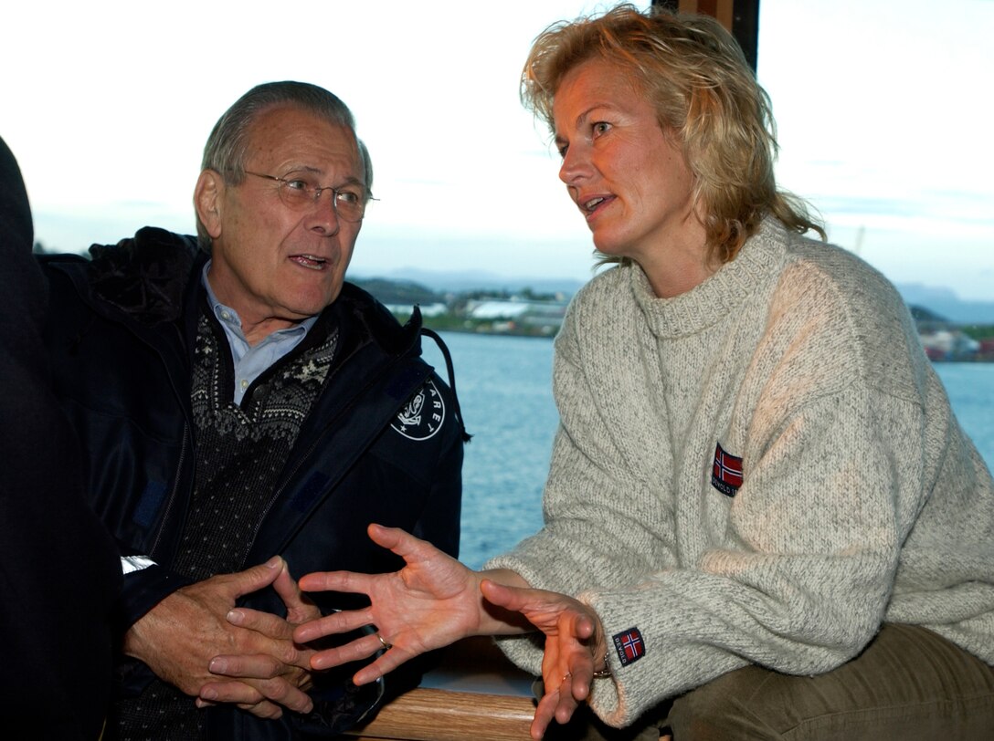 Norwegian Minister of Defense Kristin Krohn Devold talks to Defense Secretary Donald H. Rumsfeld during a dinner cruise on Lysefjord, in Stavanger, Norway, June 7. Rumsfeld is in Norway on the 100th anniversary of Norway's peaceful separation from Sweden in 1905. Photo by Tech. Sgt. Cherie A. Thurlby, USAF