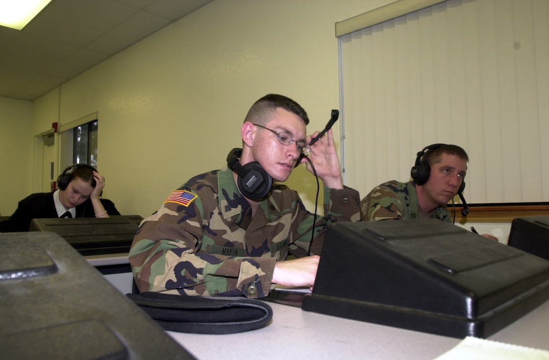 Army Spc. John Martin practices up on his Arabic skills at a Defense Language Institute language lab. Photo by Petty Officer 2nd Class Grant Probst, USN