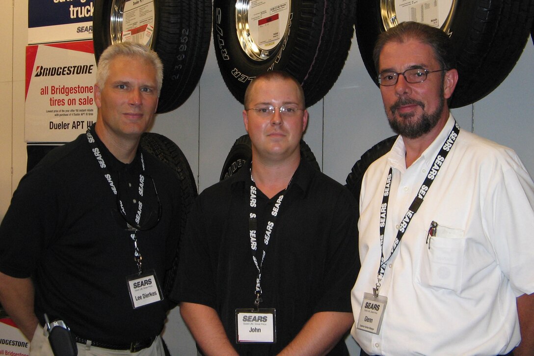Sears Auto Center customer service adviser John Winkler, center, nominated his employer for a Defense of Freedom Award through the Employer Support of the Guard and Reserve organization. District automotive center manager Lee Dierkes, left, and Glenn Bledsoe, manager of the auto center at the Huntsville, Ala., Sears store, both said they're proud of Winkler and Sears policies regarding the nation's servicemembers. Photo by Samantha L. Quigley