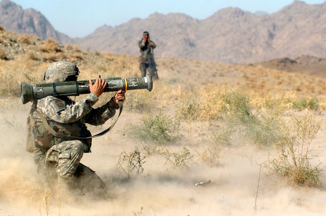 Army Sgt. Aaron Sanchez of Company A, of 1st Battalion, 325th Airborne Infantry Regiment, uses an AT4 rocket launcher to destroy an abandoned Taliban safe house in Koshk Kowl, Afghanistan, Oct. 4. Photo by Spc. Mike Pryor, USA
