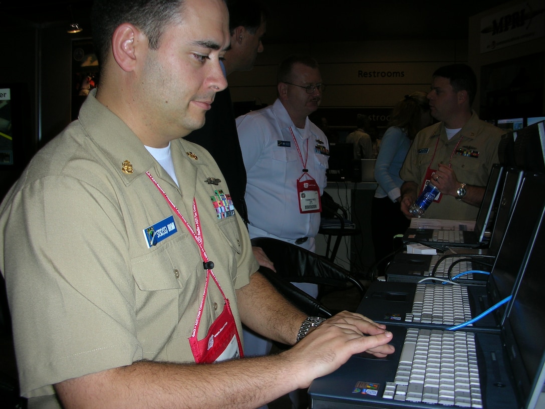 Navy Chief Petty Officer Chris Brown uses a navigation training system ...