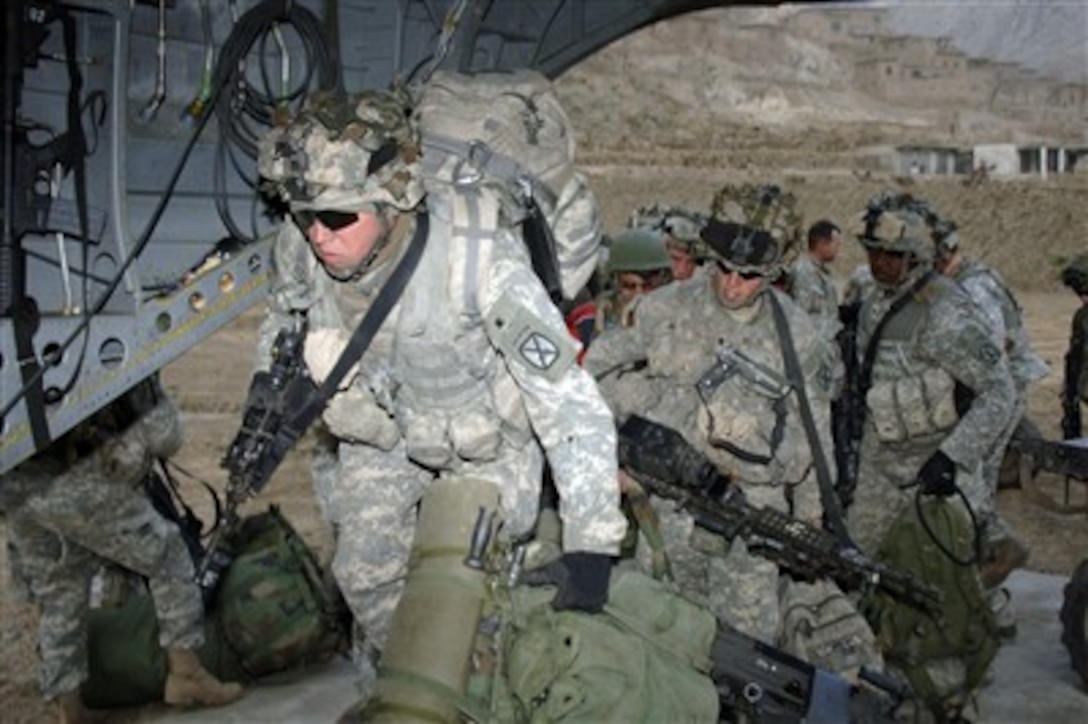 U.S. Army soldiers from the 10th Mountain Division board a CH-47 Chinook helicopter at Camp Blessing, Afghanistan, on Jan. 26, 2007.  