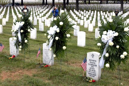 Three of the 17 sailors killed during the Oct. 12, 2000, terrorist attack on the USS Cole -- Petty Officer 2nd Class Kenneth E. Coldfelter, Seaman Cherone L. Gunn and Chief Petty Officer Richard Costelow -- are buried side by side in Arlington National Cemetery. Photo by Rudi Williams