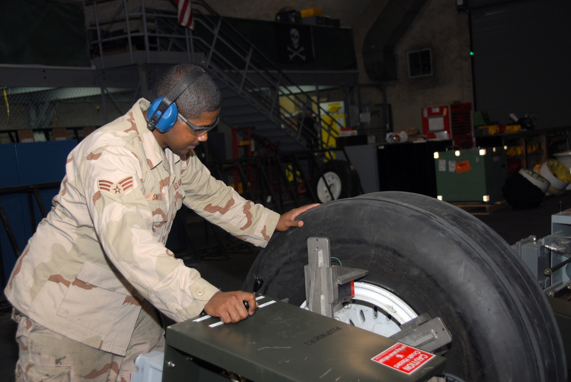 Senior Airman Ashaundei Smith, 379th Expeditionary Maintenance Squadron, is part of an eight-person team that has replenished the supply system with more than 1,000 serviceable wheel and tire assemblies to date this fiscal year. Airmen Smith is  deployed here from Fairchild Air Force Base, Washington. (U.S. Air Force photo by Airman 1st Class Ashley Tyler) 