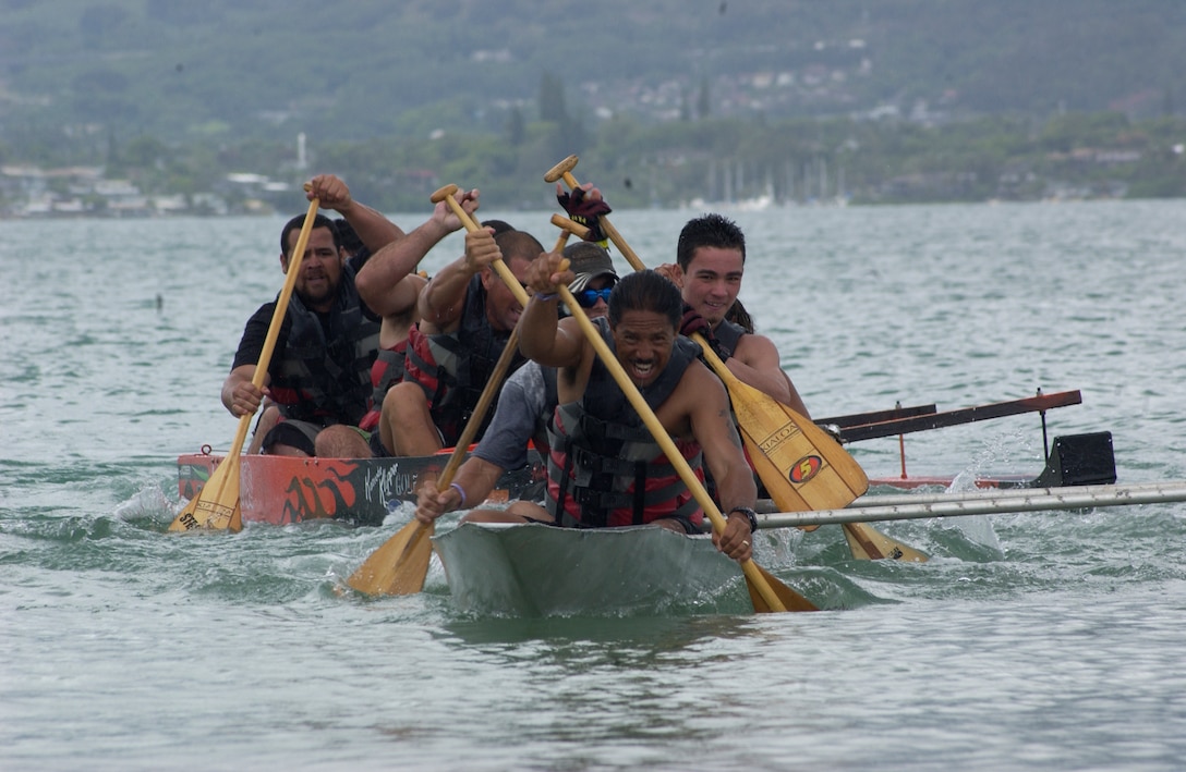 Guy E. Naito leads his team, Facilities Flagship, to shore to win the championship of the Bathtub Regatta, July 1, during the 18th annual Bayfest. Facilities Flagship took home the championship, defeating the two-year streak the S.S. Nishida had.