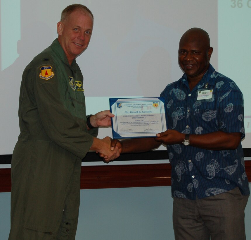 Col. Joel Westa, 36th Wing vice commander, presents Russ Grossley, 36th Civil Engineer Squadron, with a certificate for his positive efforts in pollution prevention. (U.S. Air Force Photo/Staff Sgt. Chris Powell)