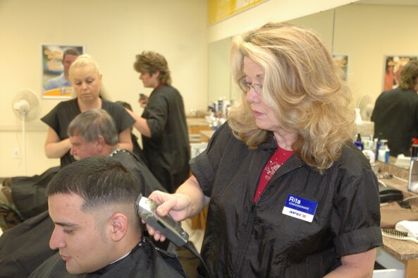 Rita Gentry, civilian barber, performs a fade hair cut at the Base Exchange barbershop. Ms. Gentry has worked on base for 19 years and continues to trim up the service members at Warren (Photo by Airman 1st Class Daryl Knee).
