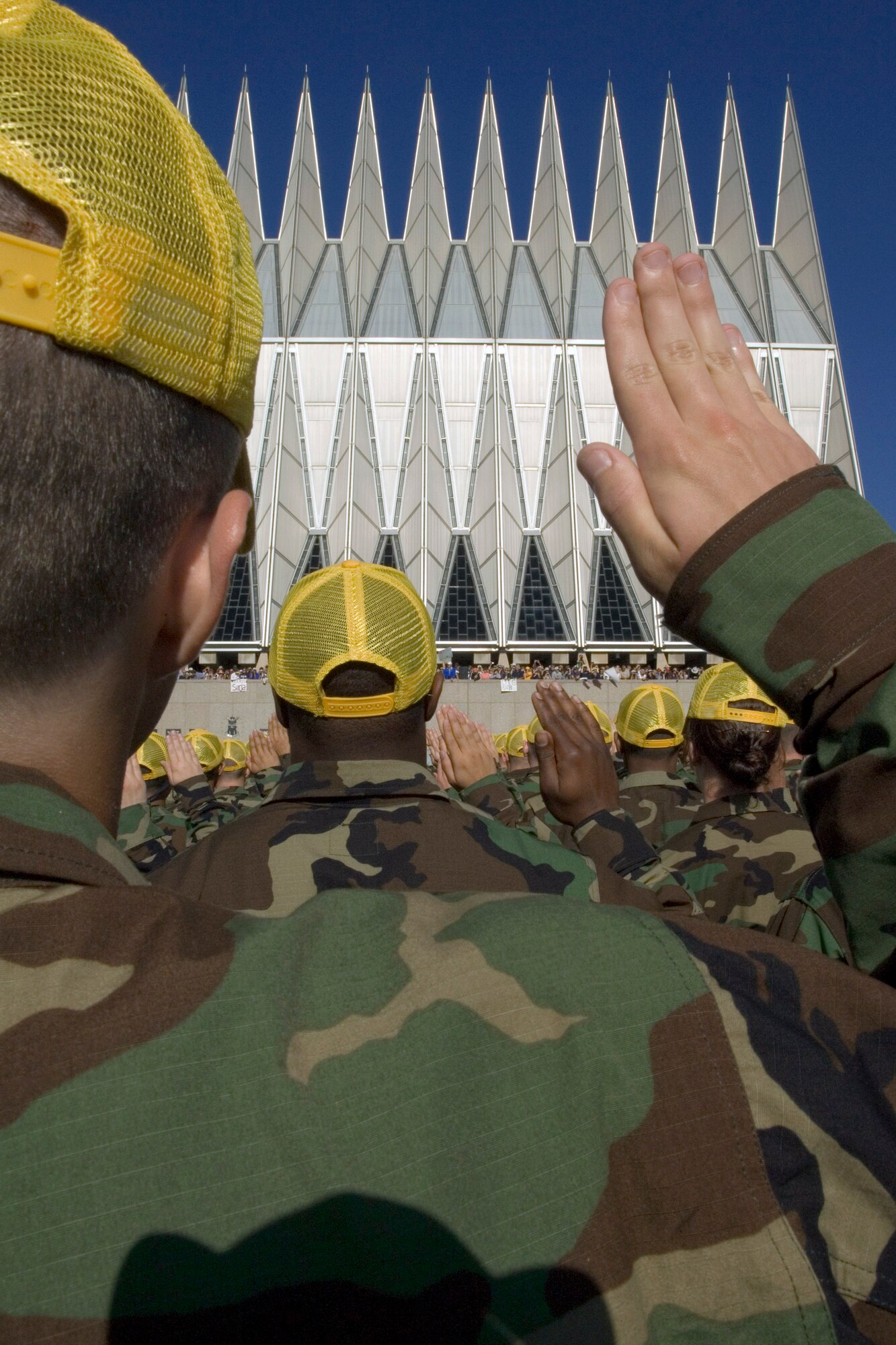 Basic cadets are administered the oath during the swearing-in ceremony as friends and family cheer on their loved ones June 29 at the U.S. Air Force Academy in Colorado. This ceremony marks the beginning of the first half of basic cadet training, commonly known as "First Beast." (U.S. Air Force photo/Joel Strayer) 

