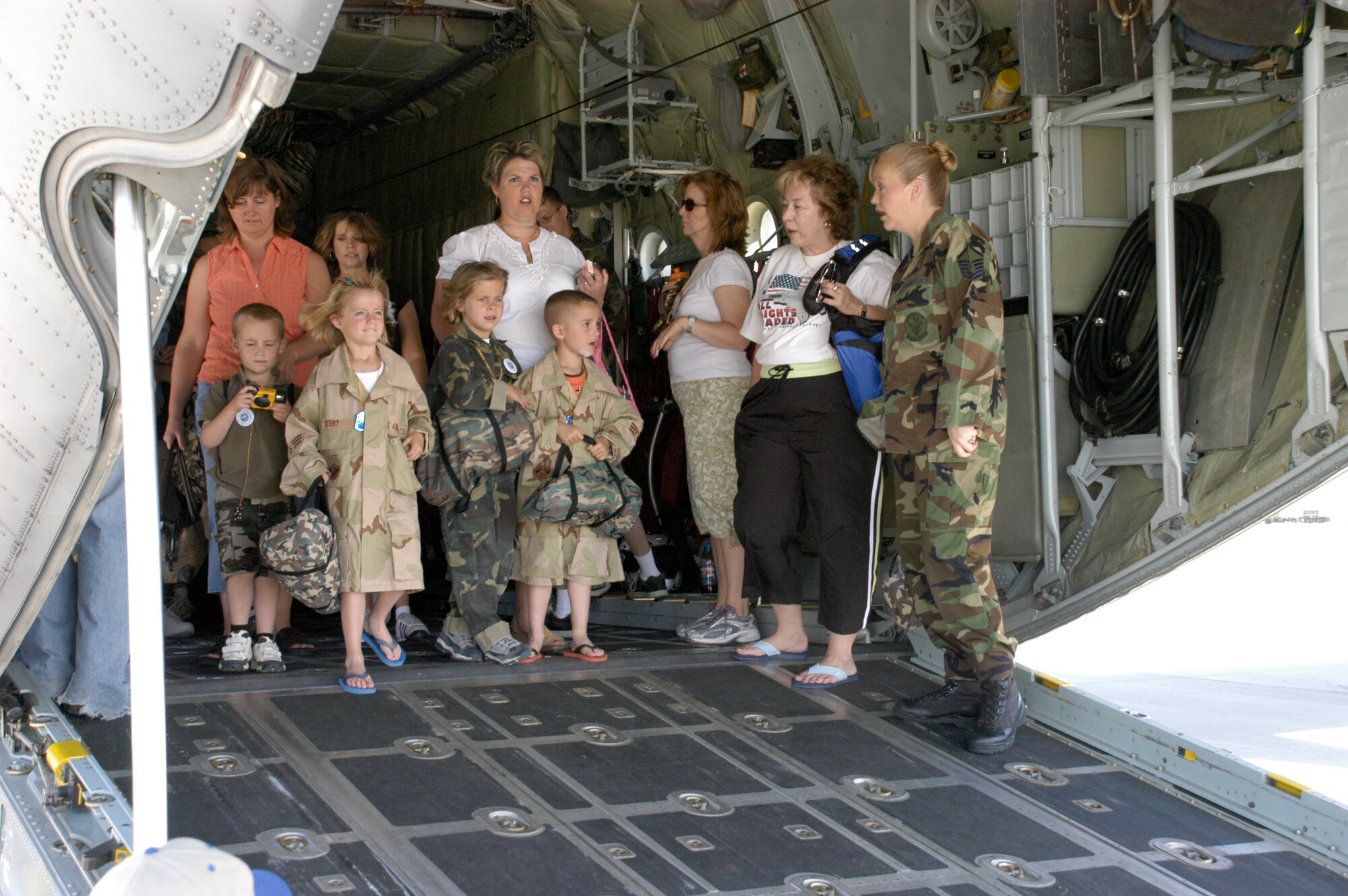 A group of children prepare to exit the cargo hold of a Wyoming Air National Guard C-130 Hercules at the Cheyenne Regional Airport Saturday. More than 50 children participated in Warren’s first Junior Deployer program to teach children what it’s like to deploy (Photo by 2nd Lt. Lisa Meiman).
