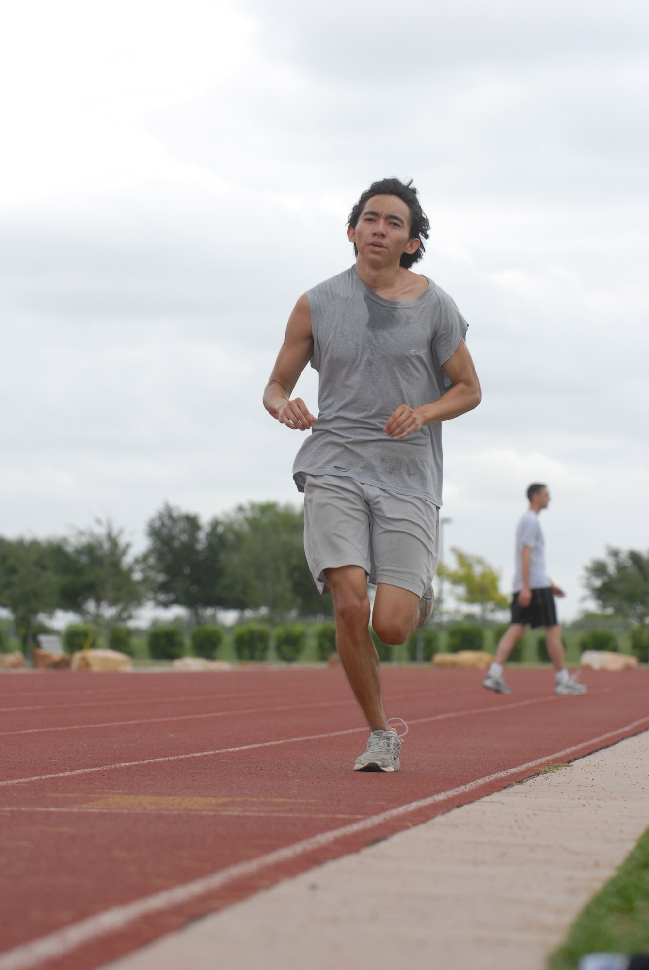 Miko Montemayor, 17th Services Division lifeguard, competes in the three-mile portion of the second annual triathlon Saturday. Montemayor helped his team place second overall. His team finished with a time of 56 minutes and 26 seconds. (U.S. Air Force photo by Staff Sgt. John Barton)