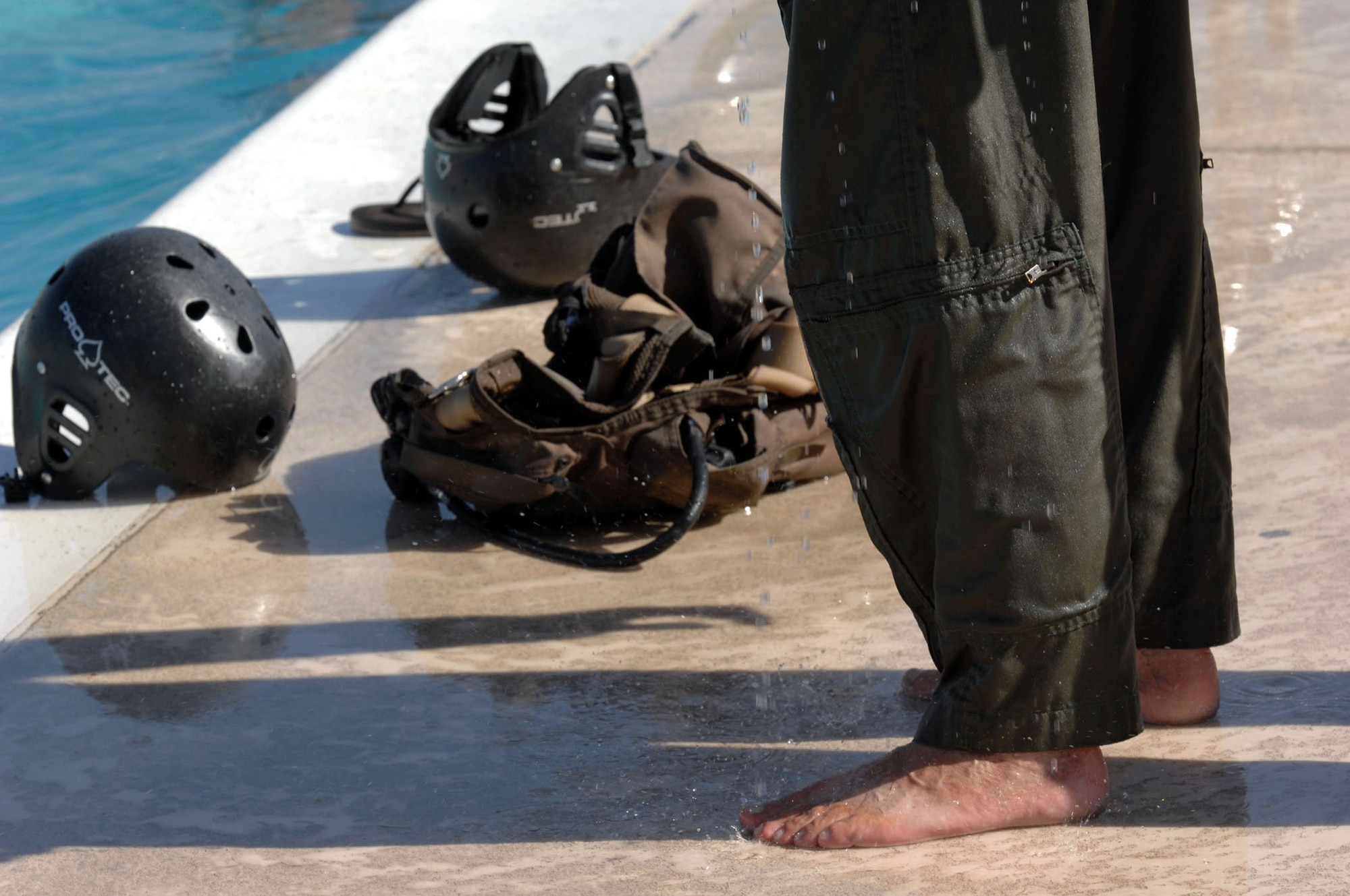 A Nevada Army National Guard aircrew member waits his turn to re-enter the pool for training on a helicopter underwater dunker device during his annual water survival training.  The training is conducted by survival, evasion, resistance and escape, or SERE, instructors at Nellis Air Force Base, Nev.  (U.S. Air Force photo/Master Sgt. Kevin J. Gruenwald)